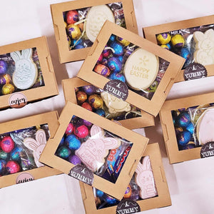 Easter gift box filled with chocolate and cookie.