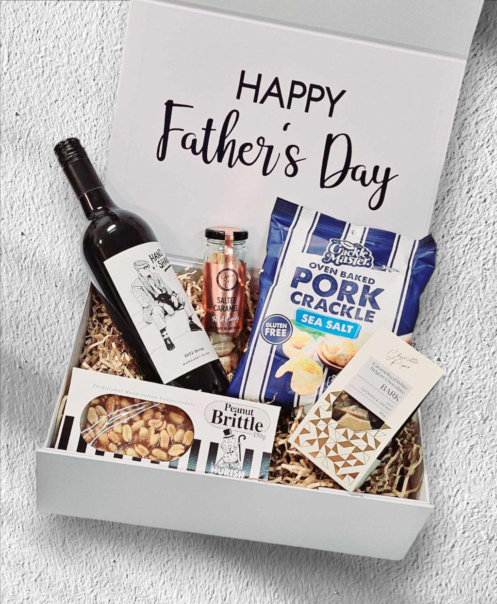 Father's Day Box 1: A premium gift set designed to indulge the special man in your life. Includes Handshake Red Wine from Margaret River, salted caramel boiled lollies, sea salt pork crackle, Morish Nute peanut brittle, and caramel chocolate bark—perfect for a sophisticated and indulgent Father’s Day celebration.