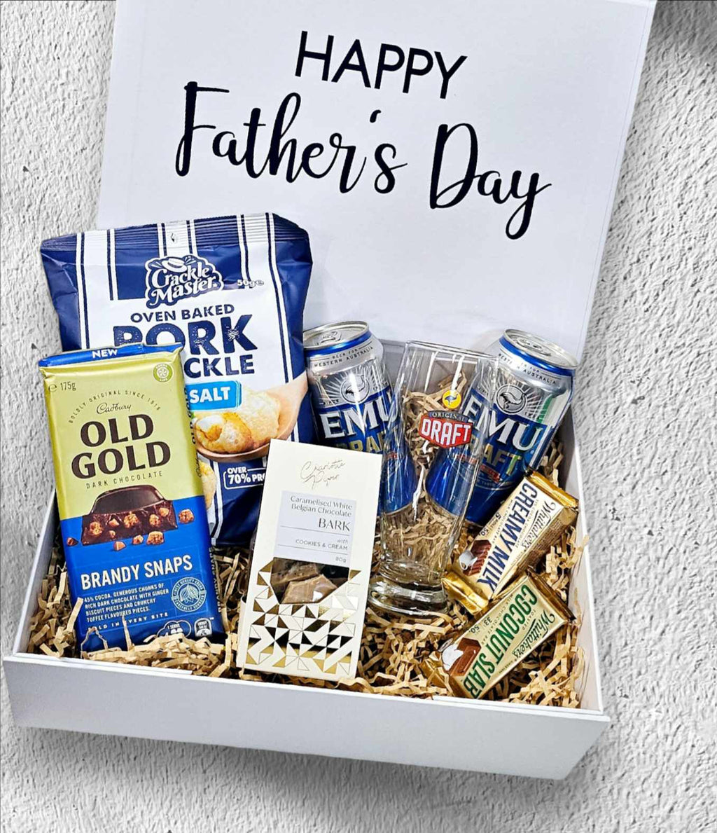Father's Day Box 2: A premium collection of gourmet treats and beverages for the dad who enjoys the finer things. Includes oven-baked pork crackle, Old Gold dark chocolate, caramel bark chocolate, Emu Draft beer cans, an Emu Draft tumbler, and Whittaker's Minis—perfect for a memorable Father’s Day celebration.