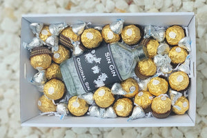 Chocolates & Spirits Gift Box: Celebrate someone special with a perfect pairing of 200ml Sin Gin Original Sin, 15 Ferrero Rocher chocolates, and Hershey's Kisses. Includes a complimentary personalized message for a thoughtful touch.