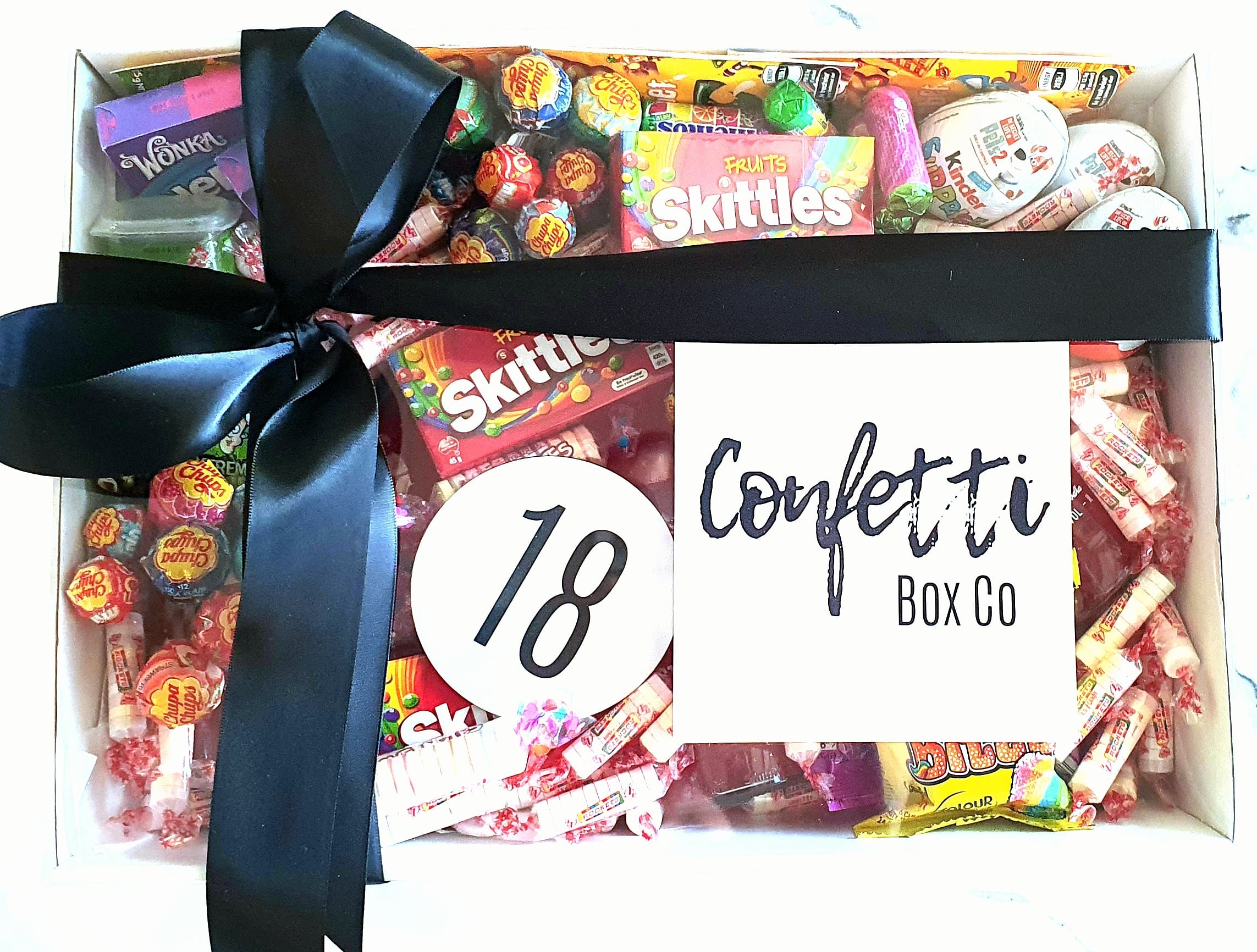Over 18's Birthday Box – A fun and unique birthday gift featuring Vodka Cruisers, Skittles, Kinder Eggs, Chupa Chups, and more. Customizable with any age. Perfect for sweet lovers who enjoy a little celebration!