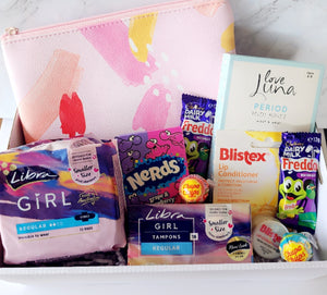 First Time Period Box: A thoughtful and supportive gift for young girls transitioning into womanhood. Includes Libra pads, tampons, Love Luna period briefs (sizes 6-8, 8-10, 12-14), lip balm, Nerds candy, Chupa Chups lollipops, Freddo Frog chocolates, assorted lollies, and an organized case. Beautifully wrapped with abundant confetti for a special and comforting touch.