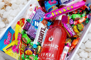 Vodka Cruiser & Sweet Treats Gift Box: Indulge in a mix of Vodka Cruiser and an assortment of sweet delights, including 5 Trolli bags, Chupa Chups Sour Bites, Jelly Belly pack, Fizzer, Mini Kit Kats, mini chocolates, Nerds, Skittles, and extra fizzers and lollies for the ultimate sugary indulgence.