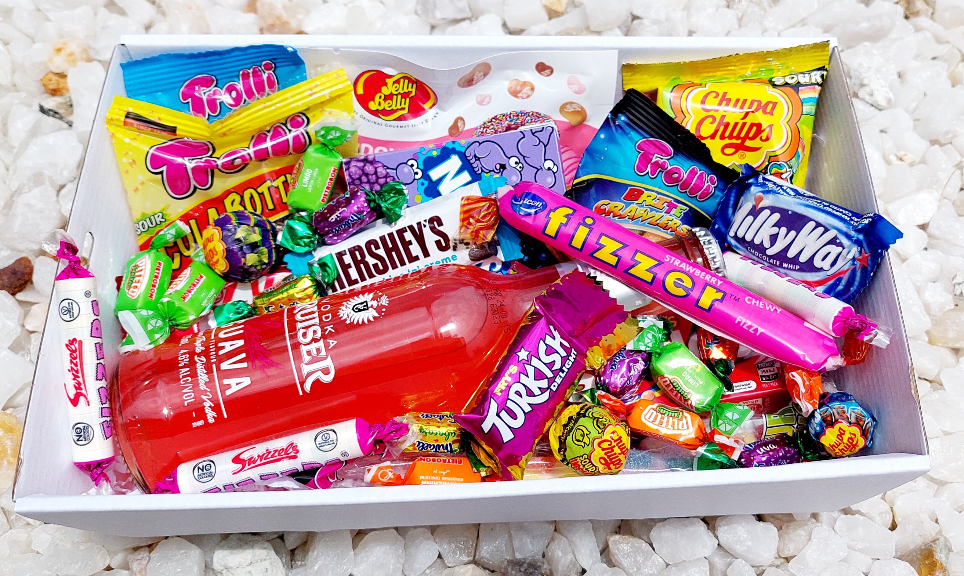 Vodka Cruiser & Sweet Treats Gift Box: Indulge in a mix of Vodka Cruiser and an assortment of sweet delights, including 5 Trolli bags, Chupa Chups Sour Bites, Jelly Belly pack, Fizzer, Mini Kit Kats, mini chocolates, Nerds, Skittles, and extra fizzers and lollies for the ultimate sugary indulgence.