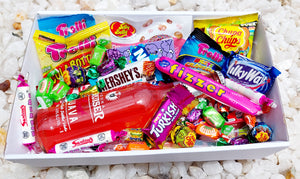 Vodka Cruiser & Sweet Treats Gift Box: Indulge in a mix of Vodka Cruiser and an assortment of sweet delights, including 5 Trolli bags, Chupa Chups Sour Bites, Jelly Belly pack, Fizzer, Mini Kit Kats, mini chocolates, Nerds, Skittles, and extra fizzers and lollies for the ultimate sugary indulgence.